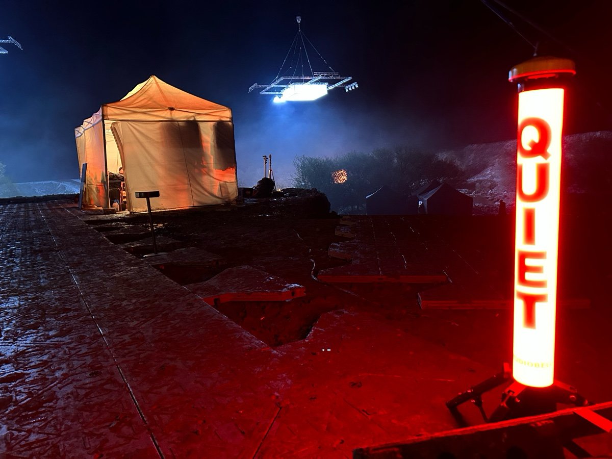 QUIET wireless bell and light system illuminated on a professional night film set